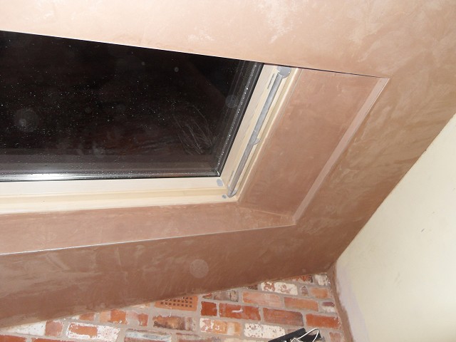 Finished plaster around ceiling Velux skylights.